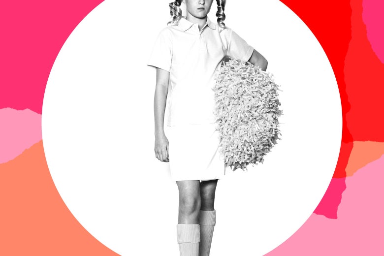 A frowning girl wearing a school uniform and holding a pompom.